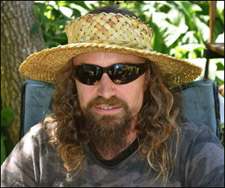 photo of a person wearing a woven flax sun visor hat