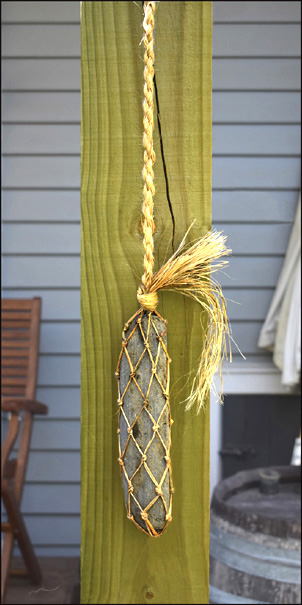 photo of stone hanging on flax cord