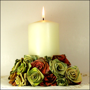 photo of candle with woven flowers at the base