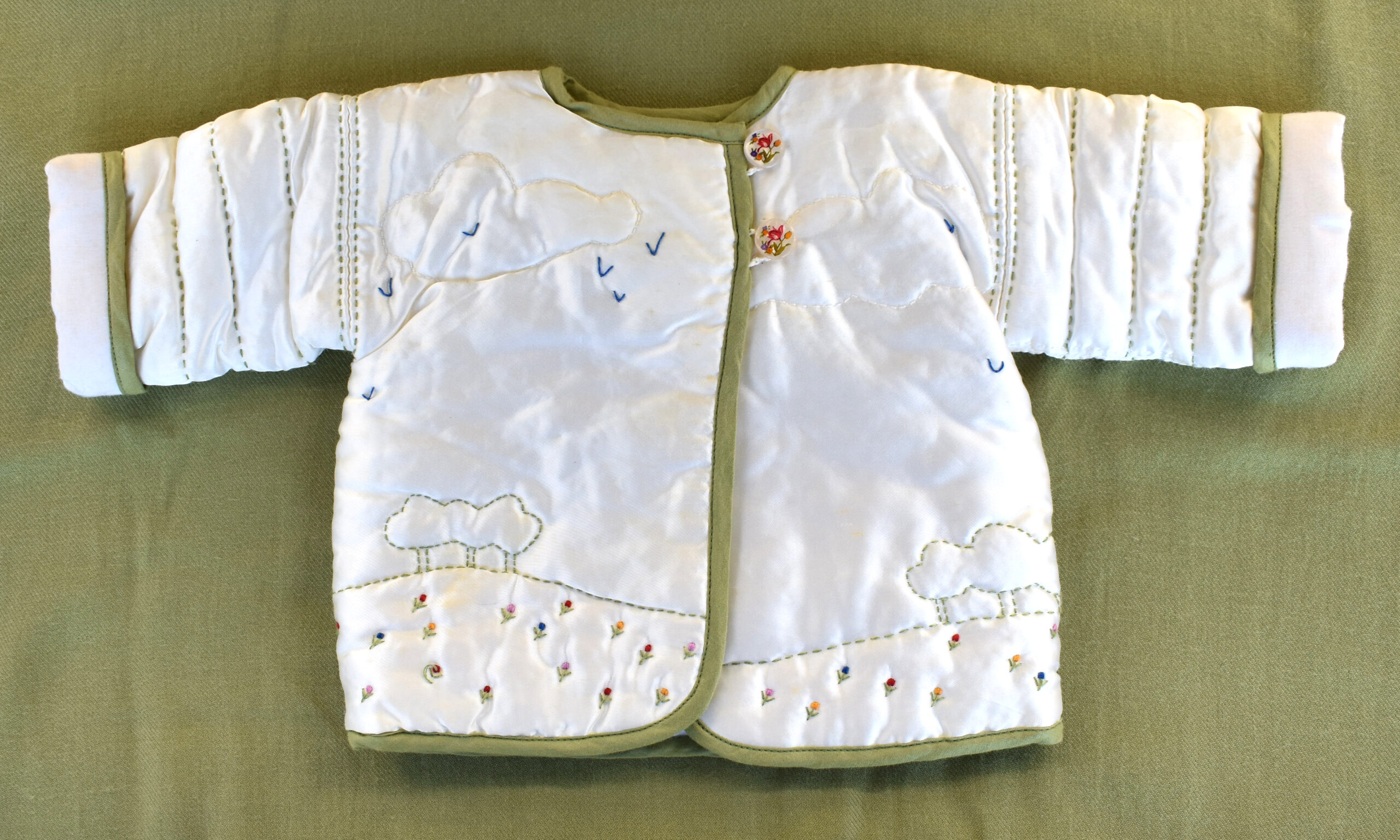 image of front of embroidered baby jacket