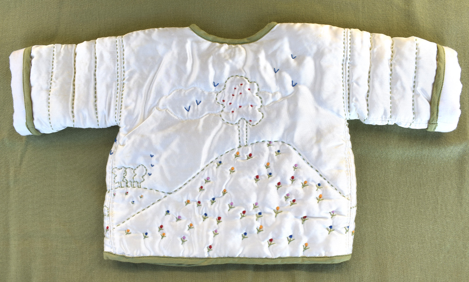 image of back of embroidered baby jacket