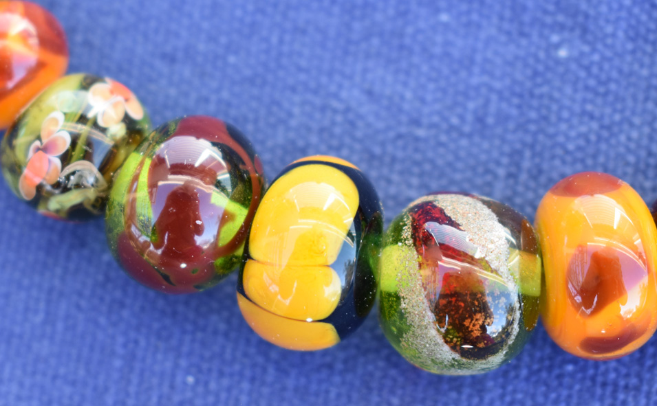 close up of necklace clasp with handmade glass beads