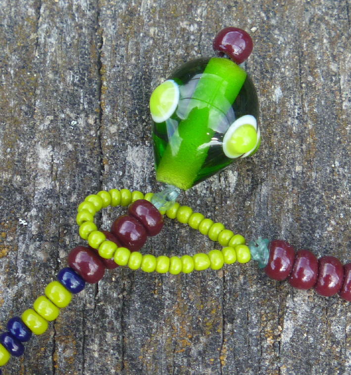 close up of necklace clasp with handmade glass beads