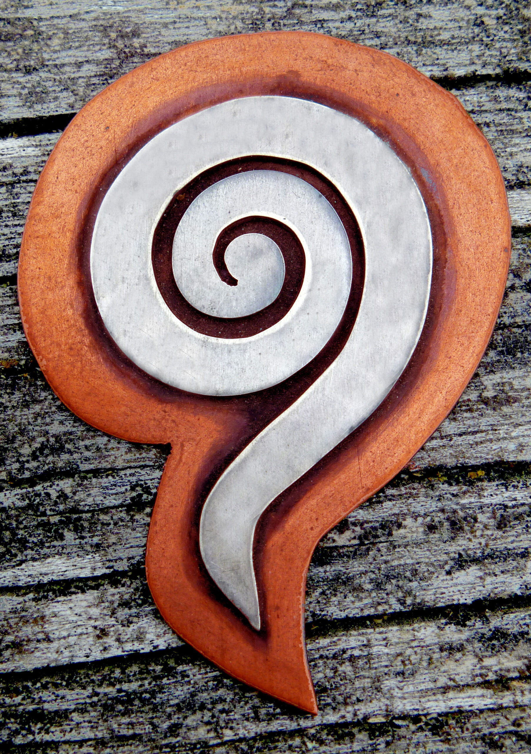 image of metal koru