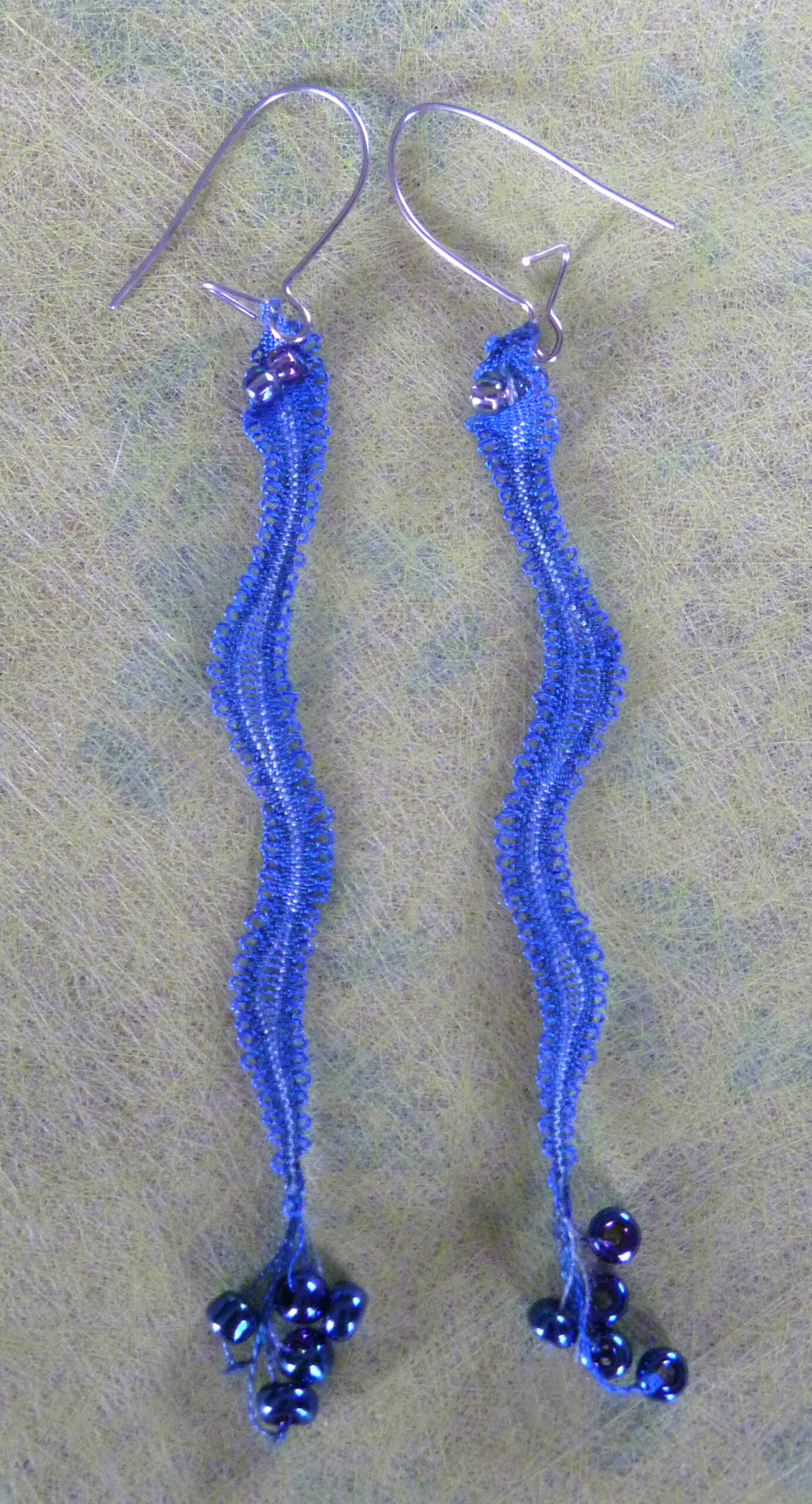 image of lace snake earrings