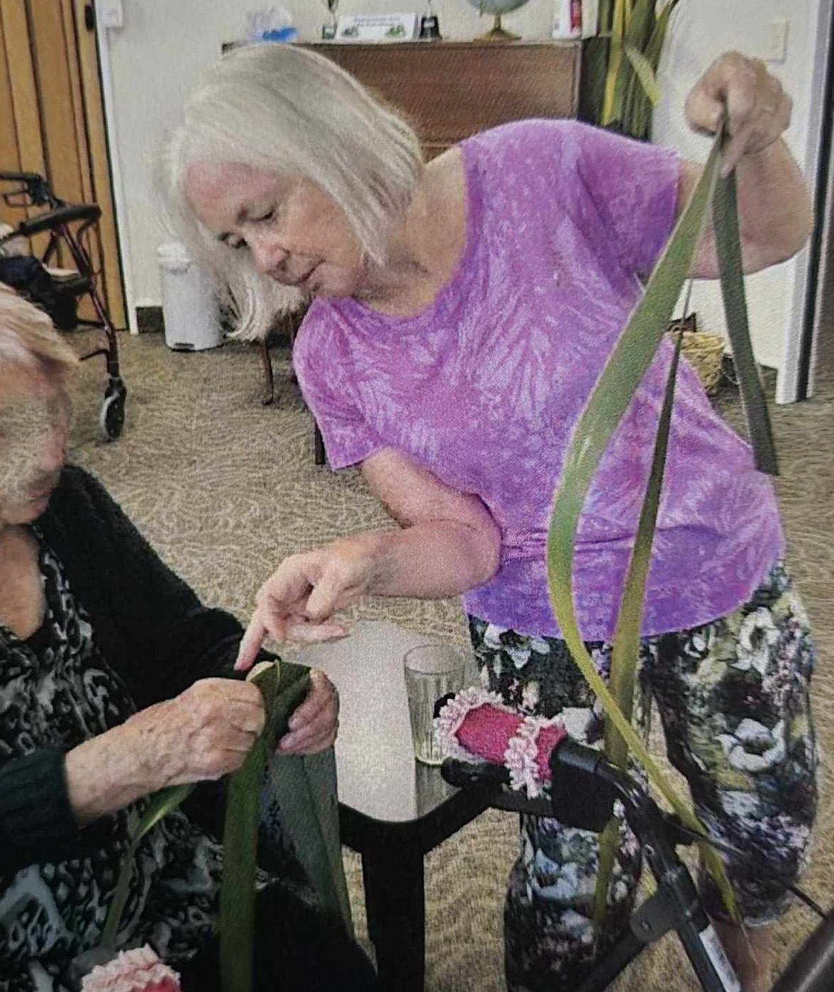 image of Ali teaching flax weaving